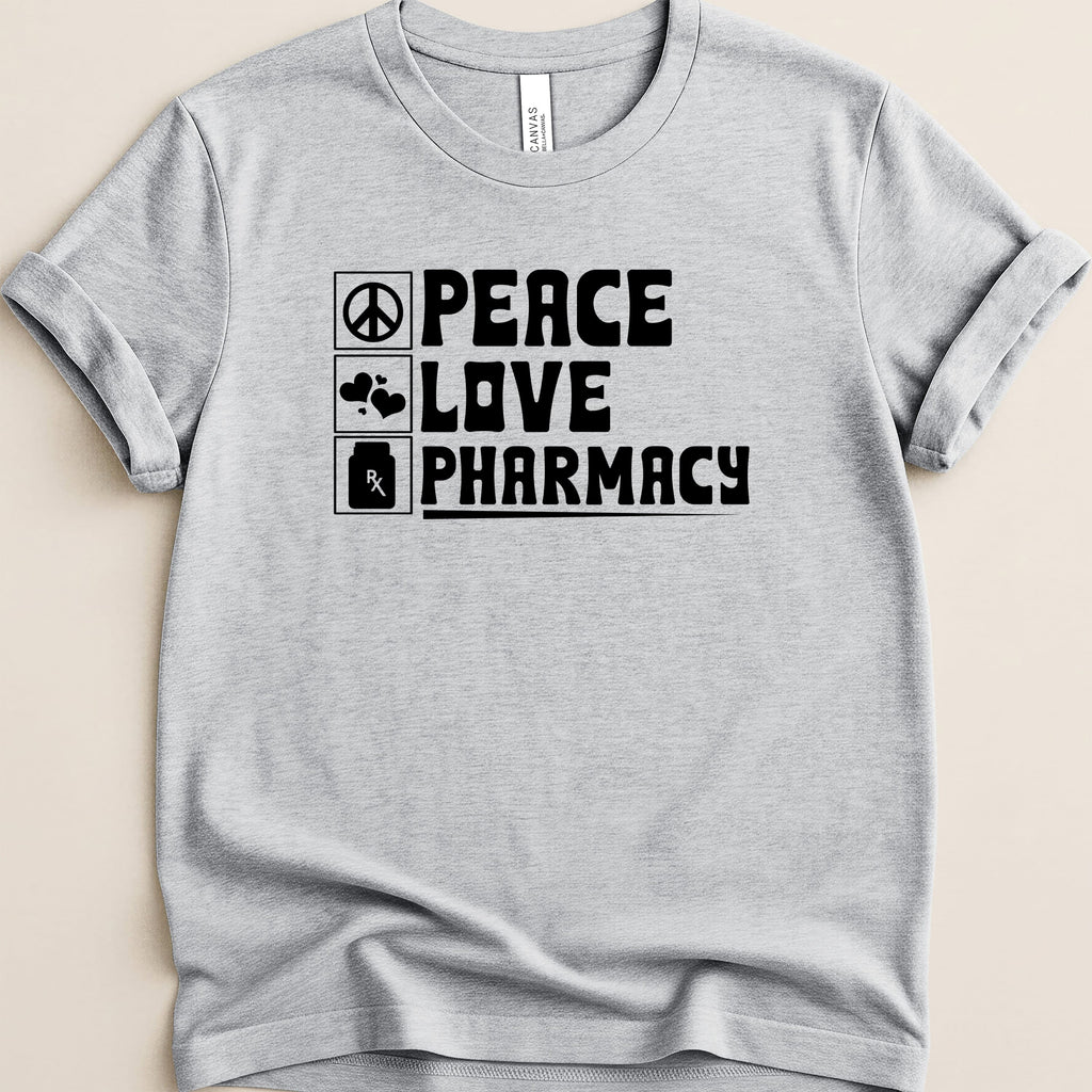 Grey t-shirt with black text: "Peace Love Pharmacy" and icons for heart and prescription.