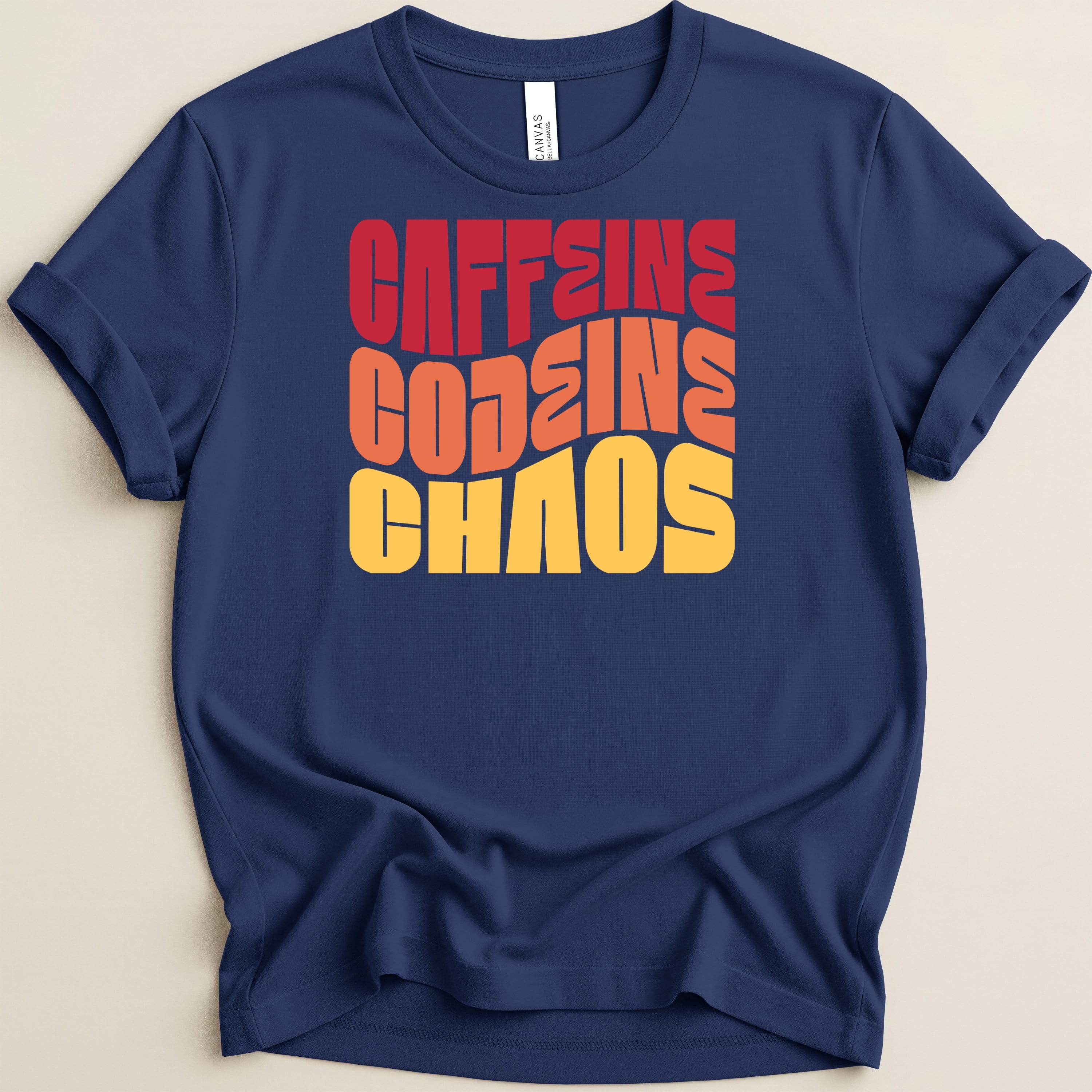 Navy t-shirt with "CAFFEINE CODEINE CHAOS" in red, orange, and yellow text.