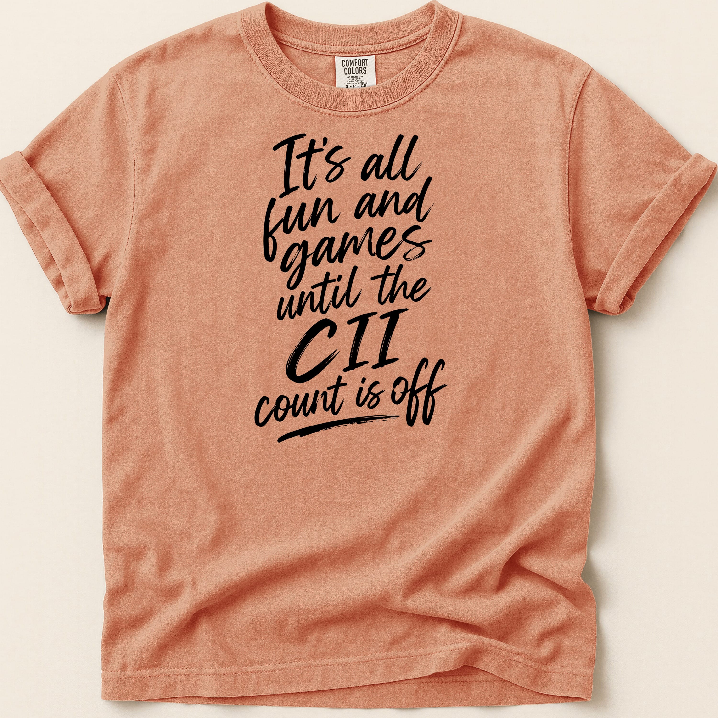 Peach t-shirt with black text: "It's all fun and games until the CII count is off".