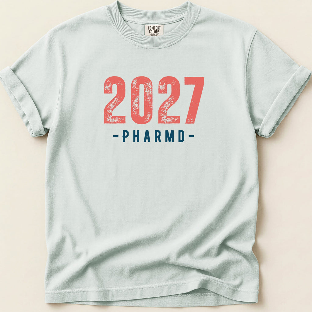 Light blue t-shirt with "2027 -PHARMD-" printed in red.