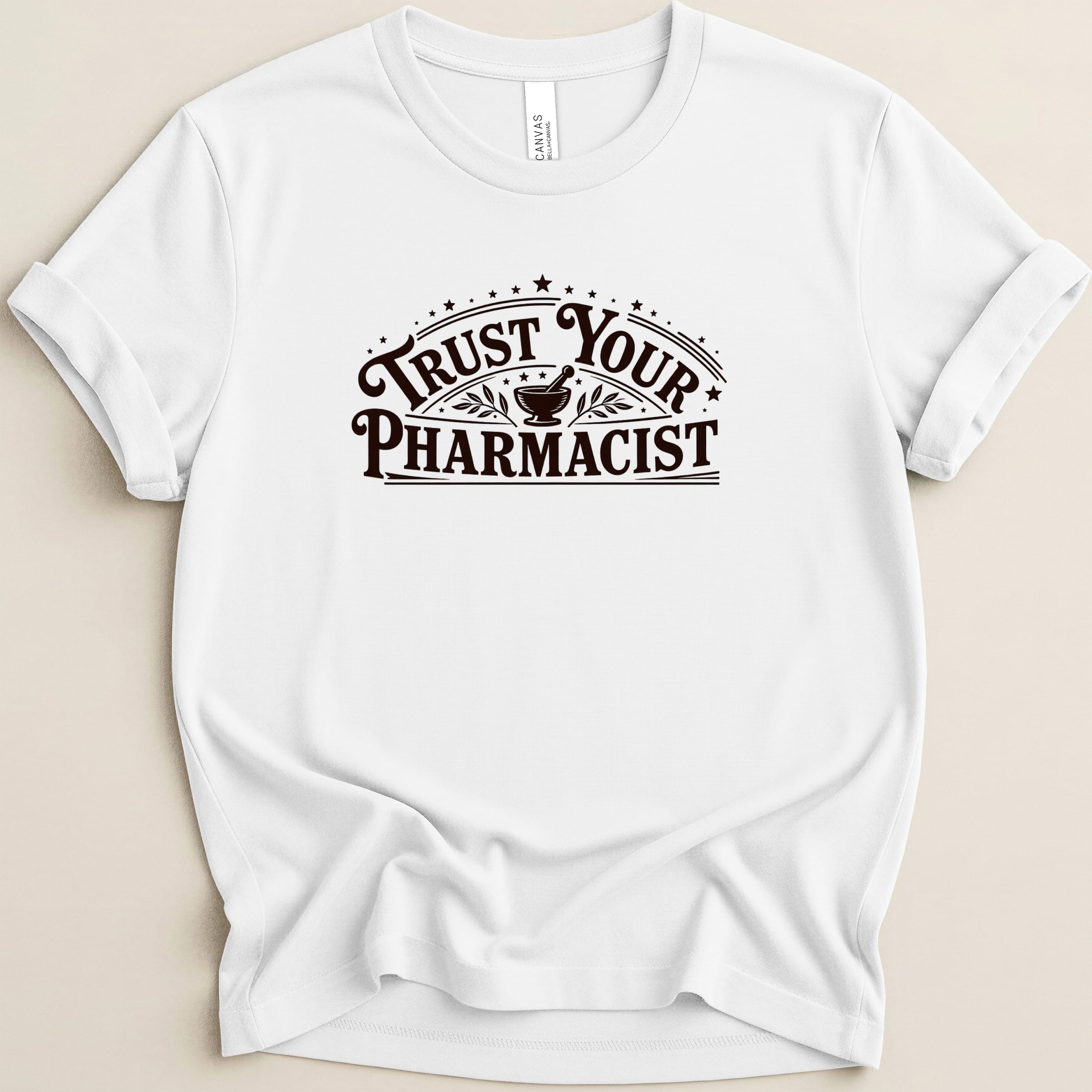 White t-shirt with "Trust Your Pharmacist" text in a dark brown, arched design.