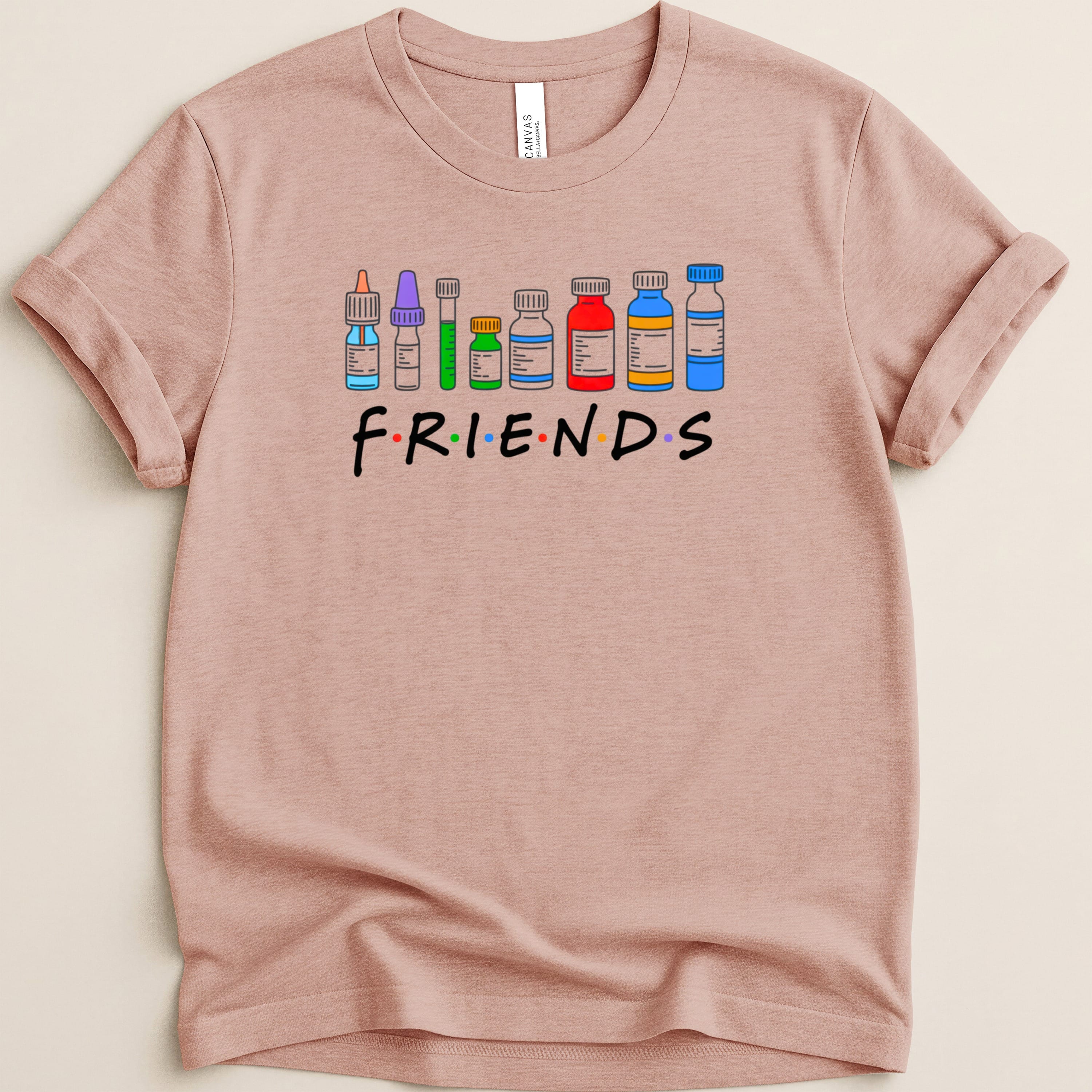 "Friends" TV show logo with medical vials instead of letters on a pink t-shirt.