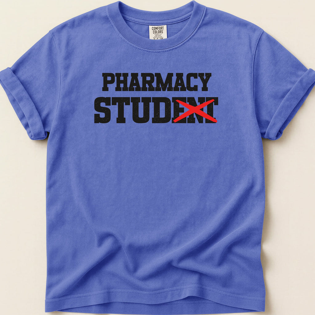 Blue t-shirt with "PHARMACY STUDENT" text, red line through "ST".