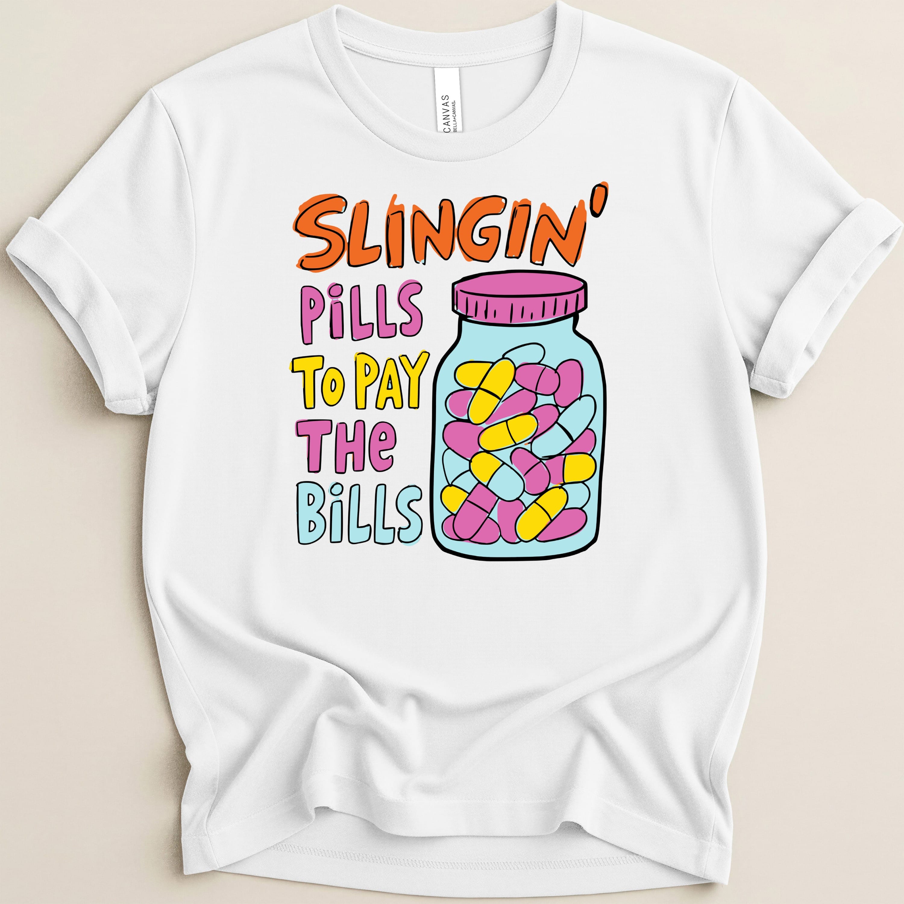 White t-shirt with "Slingin' Pills To Pay The Bills" text and a jar of pills.