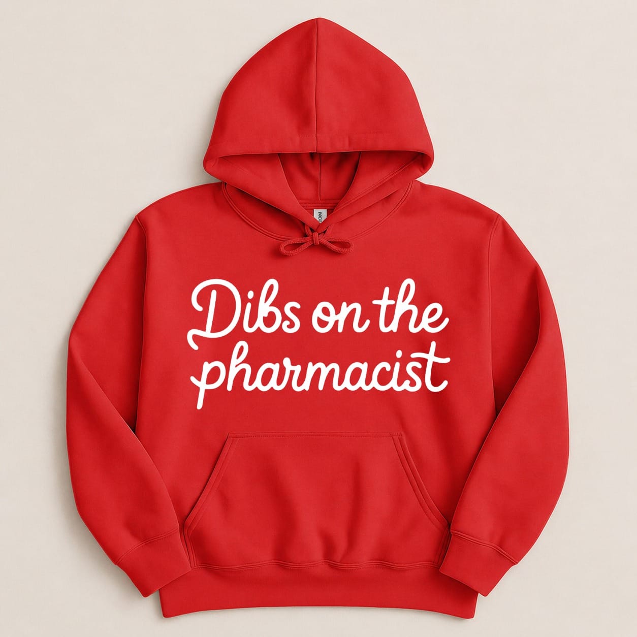 Red hoodie with "Dibs on the pharmacist" in white cursive text.