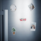 Fridge with "DRUG DEALER" sticker and two photos.