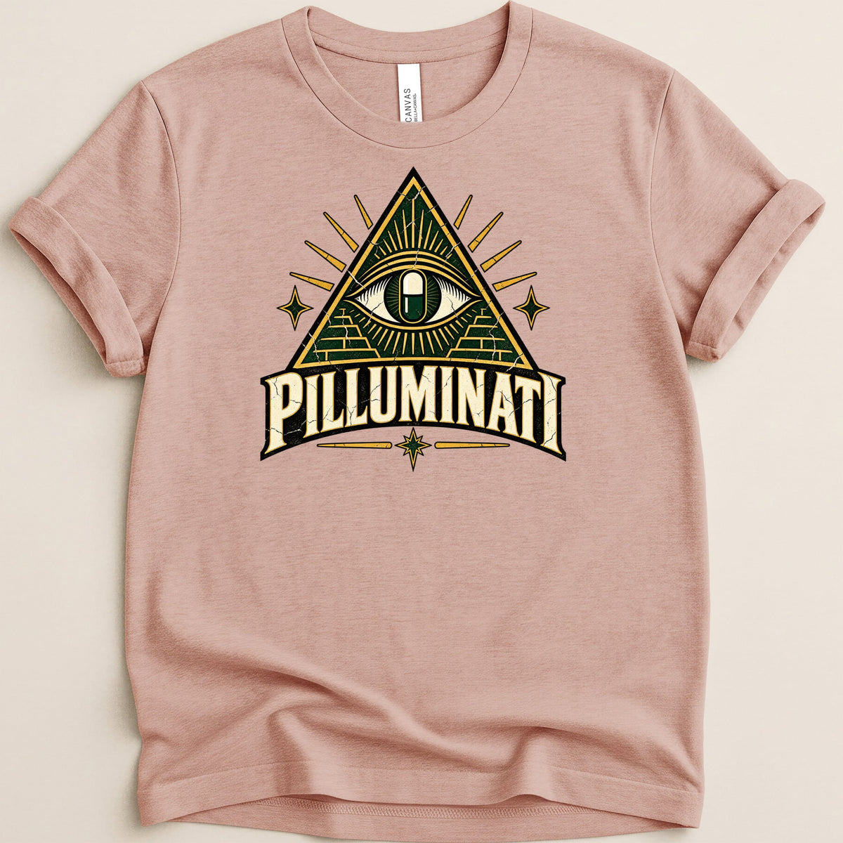 Pink t-shirt with "PILLUMINATI" text and an eye within a triangle emblem.