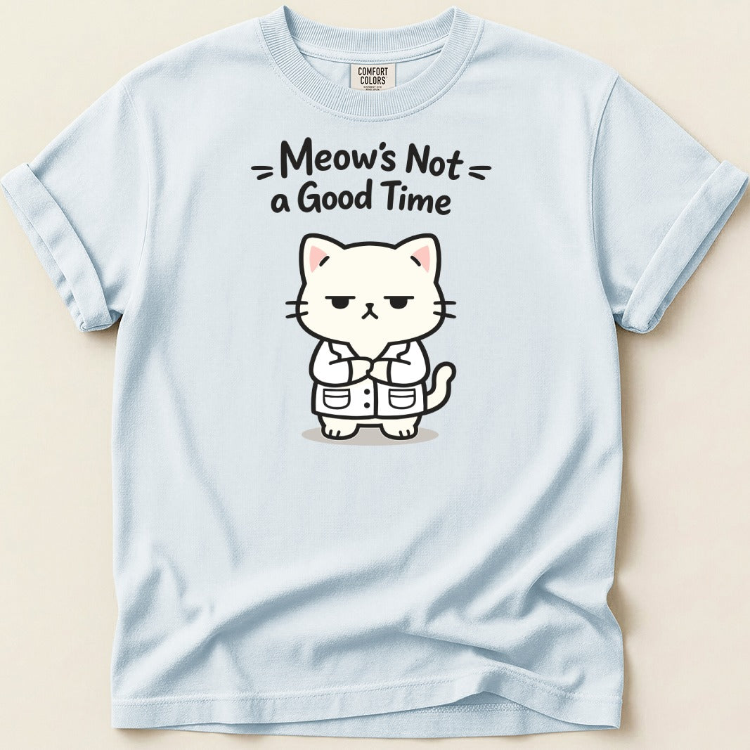 Light blue t-shirt with a grumpy cartoon cat wearing a lab coat and the text "Meow's Not a Good Time".