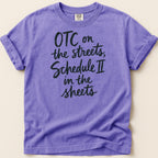 Purple t-shirt with black text reading "OTC on the streets, Schedule II in the sheets".