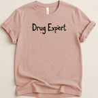 T-shirt with "Drug Expert" text in black, distressed font.