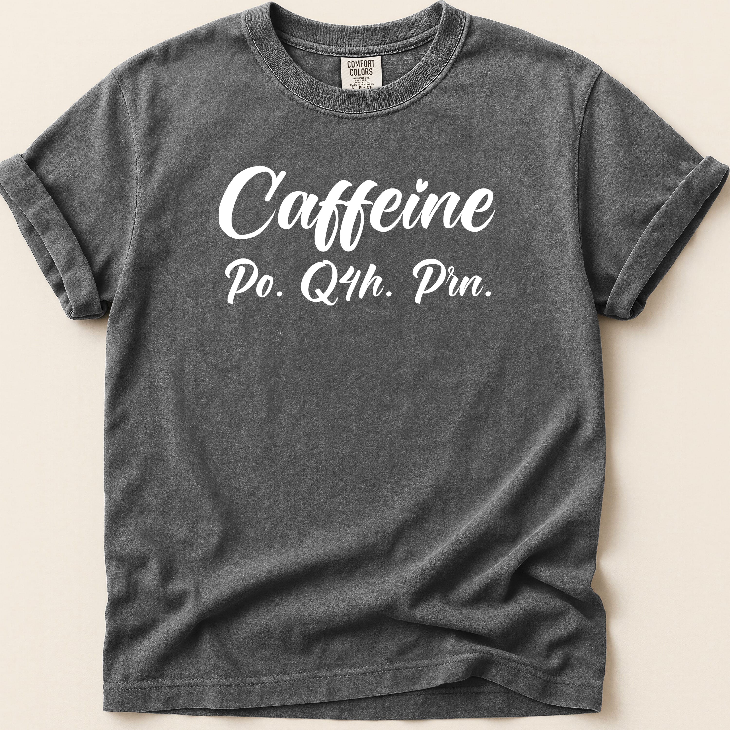 Dark gray t-shirt with "Caffeine Po. Q4h. Prn." text.
