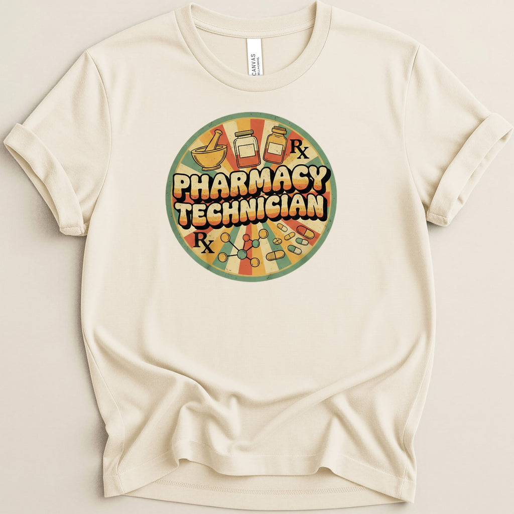 Cream t-shirt with circular pharmacy technician graphic featuring Rx symbol and pills.