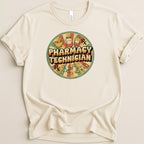 Cream t-shirt with circular pharmacy technician graphic featuring Rx symbol and pills.