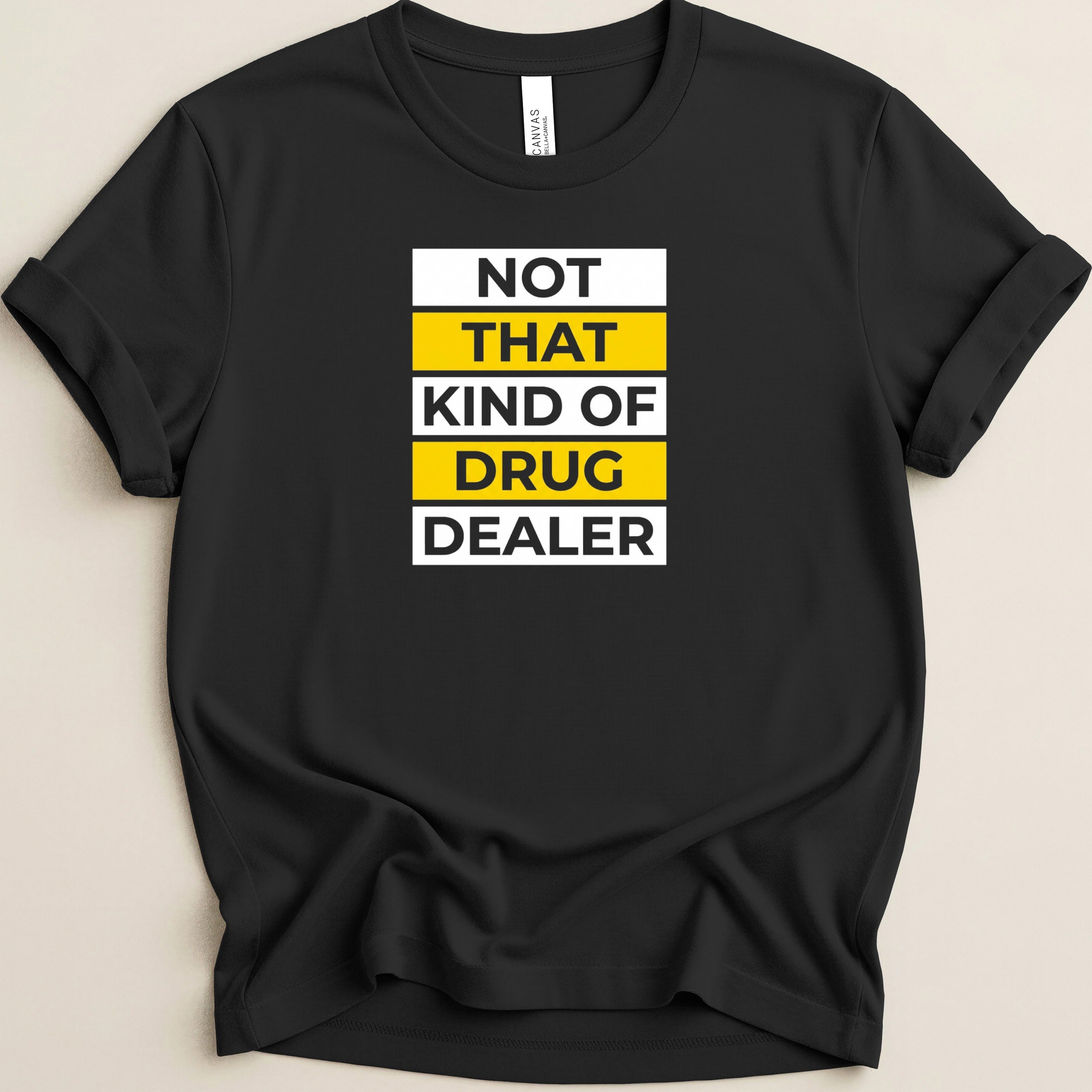 Black t-shirt with white, yellow, and gold text reading "NOT THAT KIND OF DRUG DEALER".