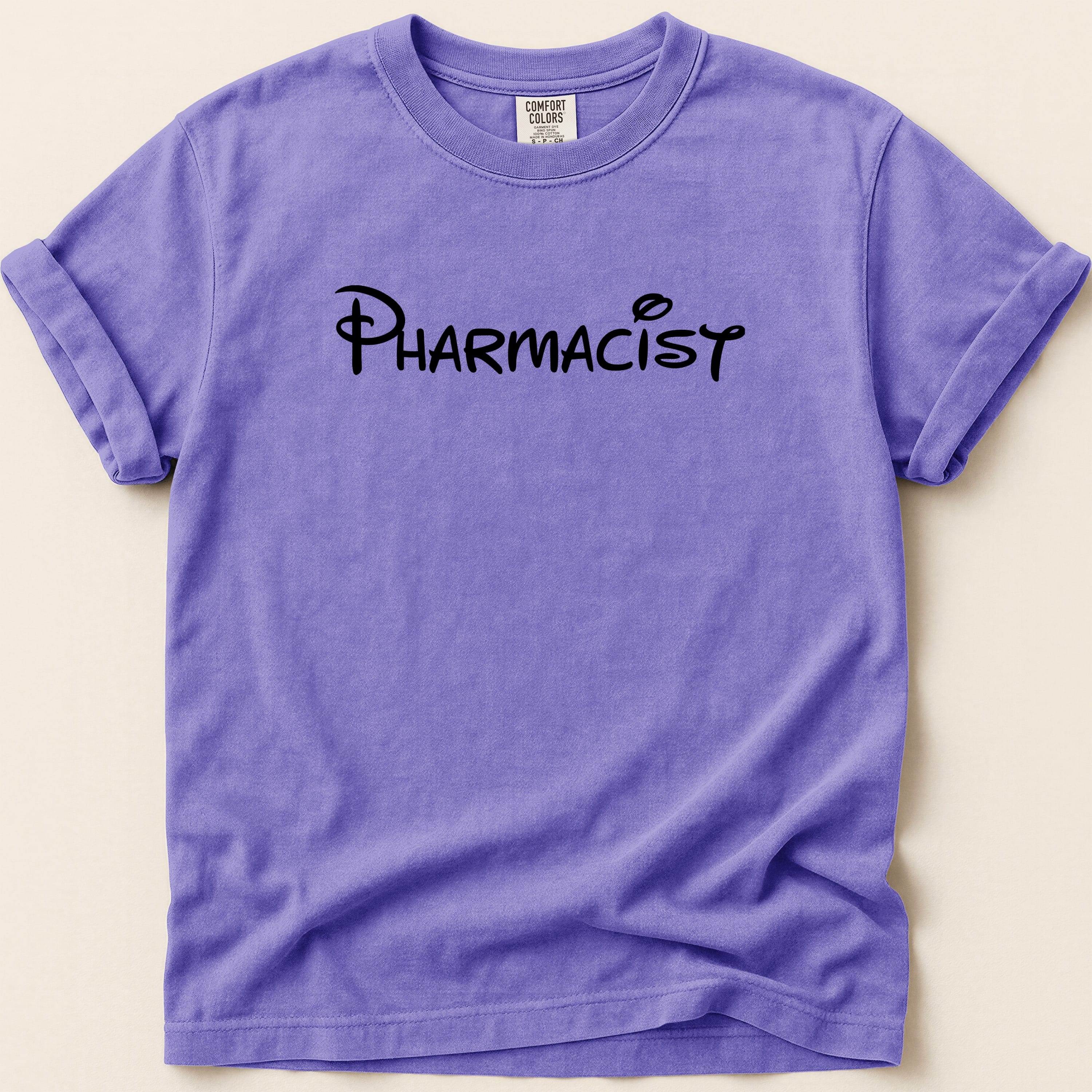 Purple t-shirt with "Pharmacist" text in black cursive font.