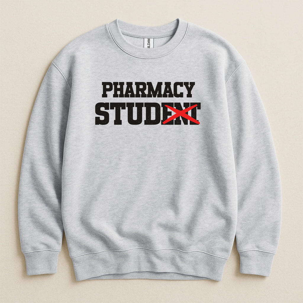Grey sweatshirt with black text reading "PHARMACY STUDENT" with "STUDENT" crossed out.