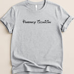 Grey t-shirt with "Pharmacy Technician" in black cursive font.
