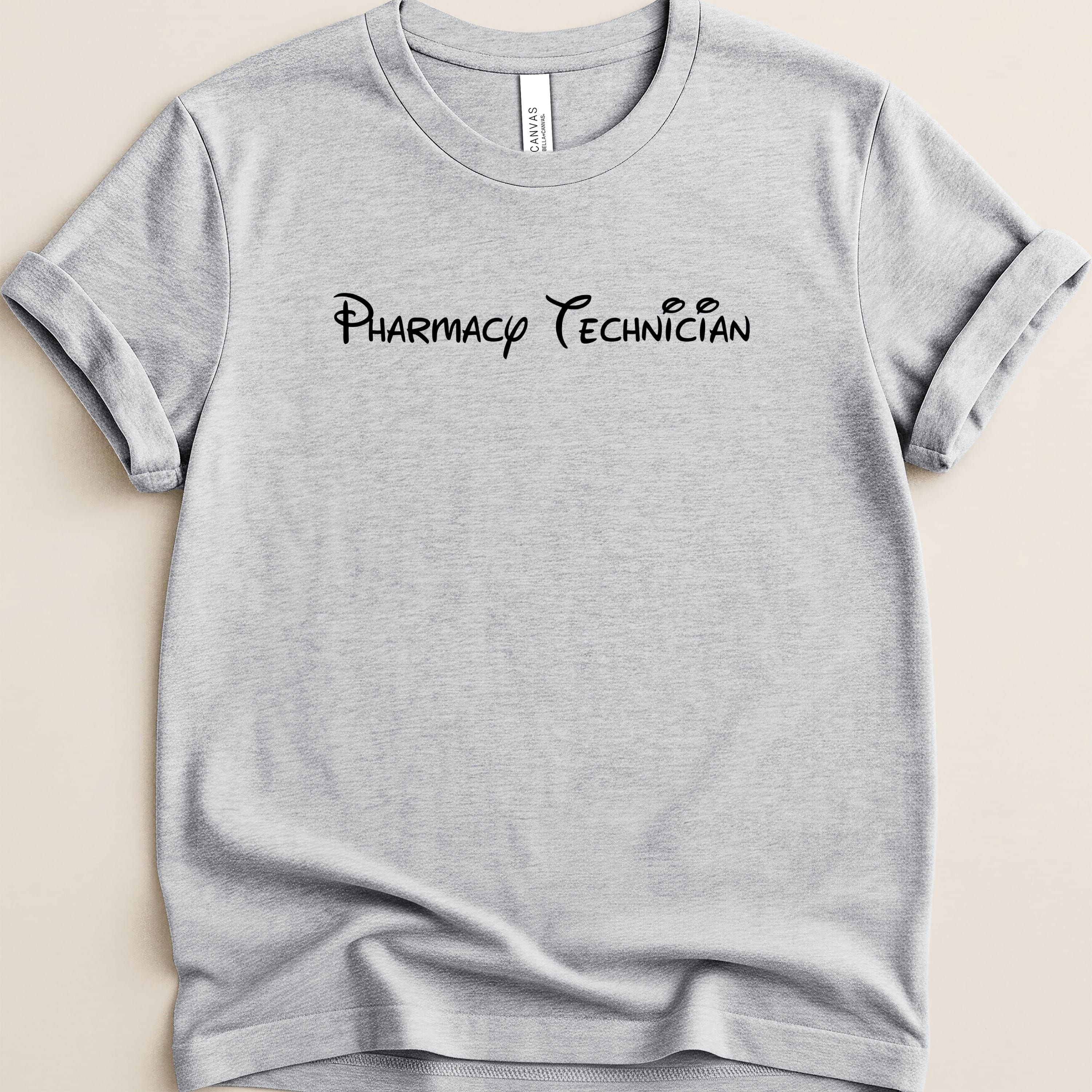 Grey t-shirt with "Pharmacy Technician" in black cursive font.