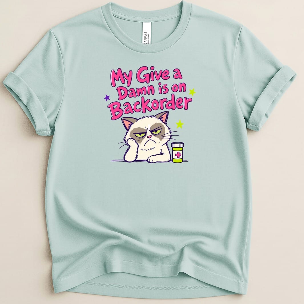 Light blue t-shirt with grumpy cat graphic and text "My Give a Damn is on Backorder".