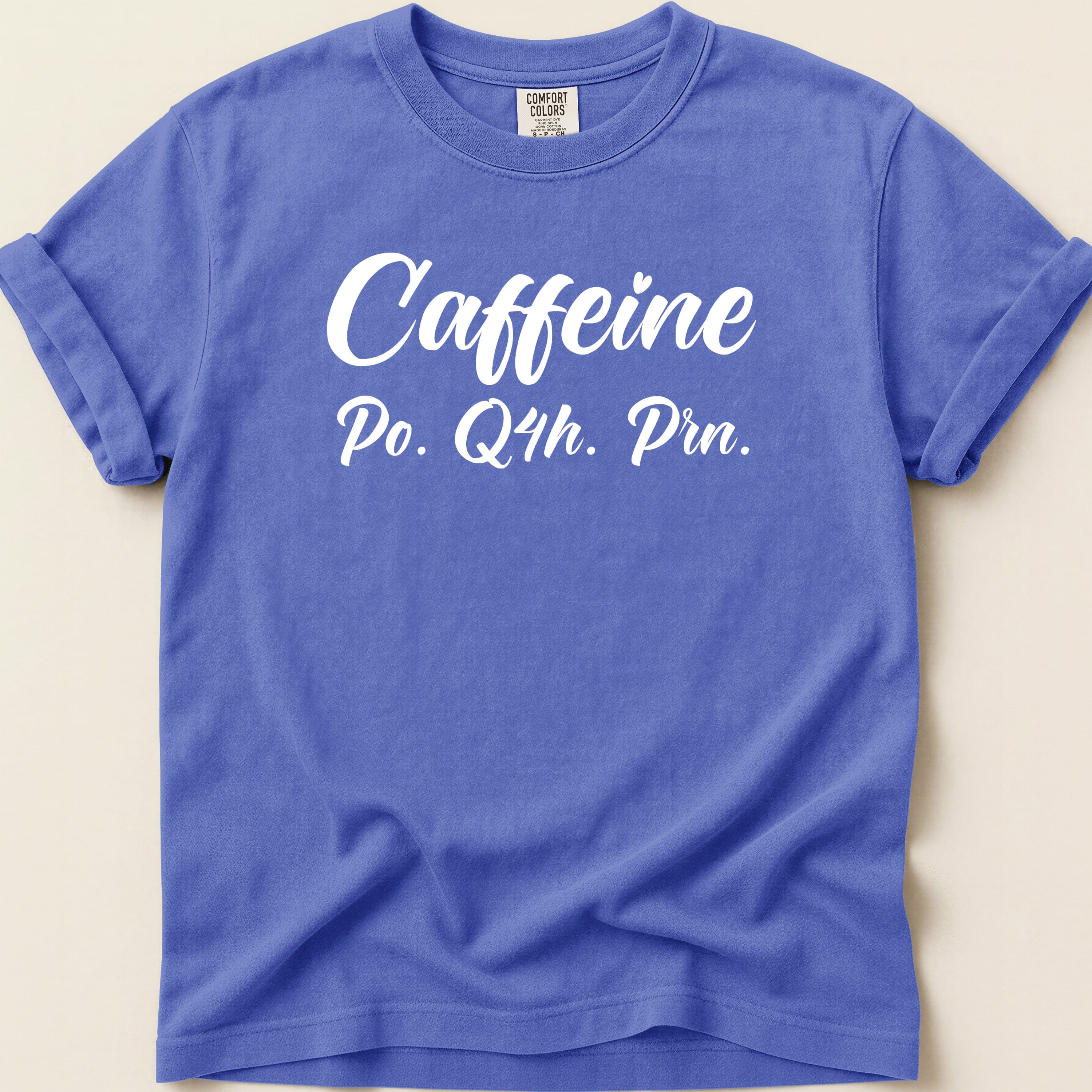 Purple t-shirt with "Caffeine Po. Q4h. Prn." in white text.