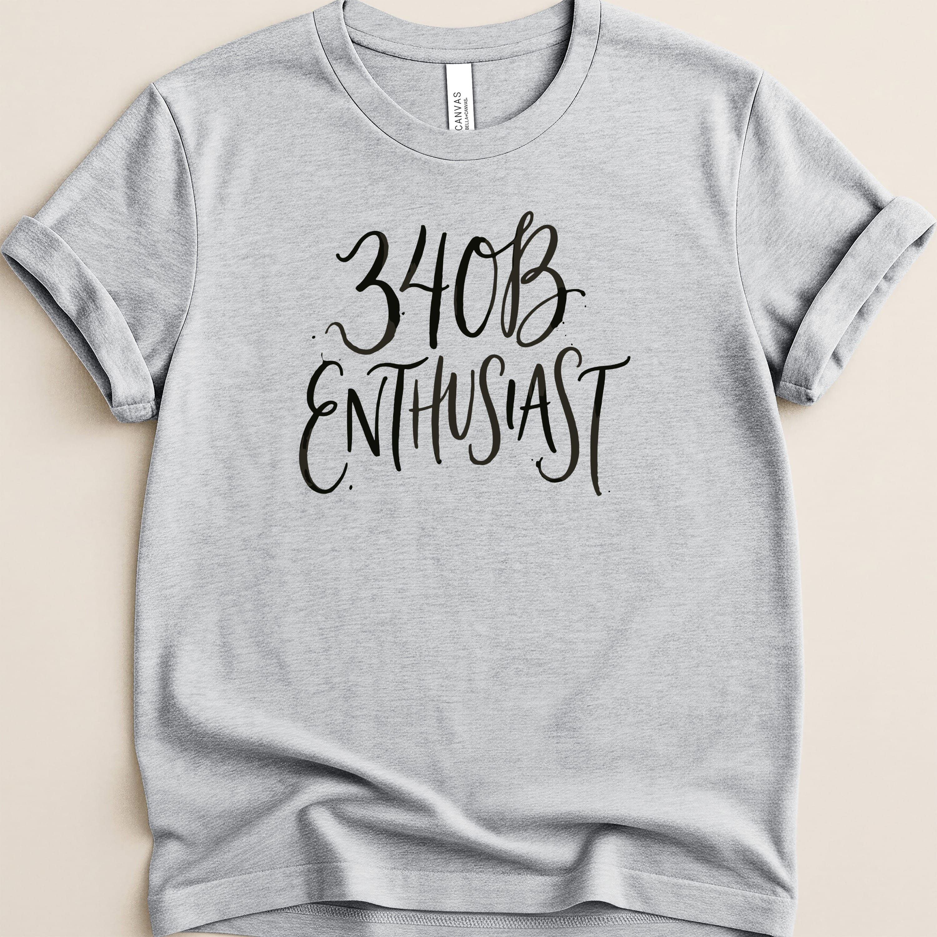 Gray t-shirt with black text that reads "34B ENTHUSIAST".