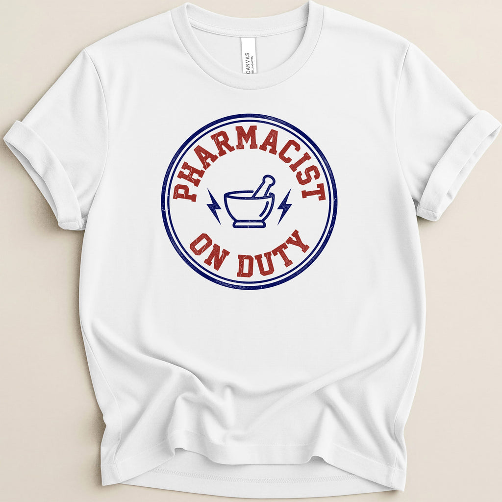 White t-shirt with "Pharmacist on Duty" circular graphic and mortar and pestle.