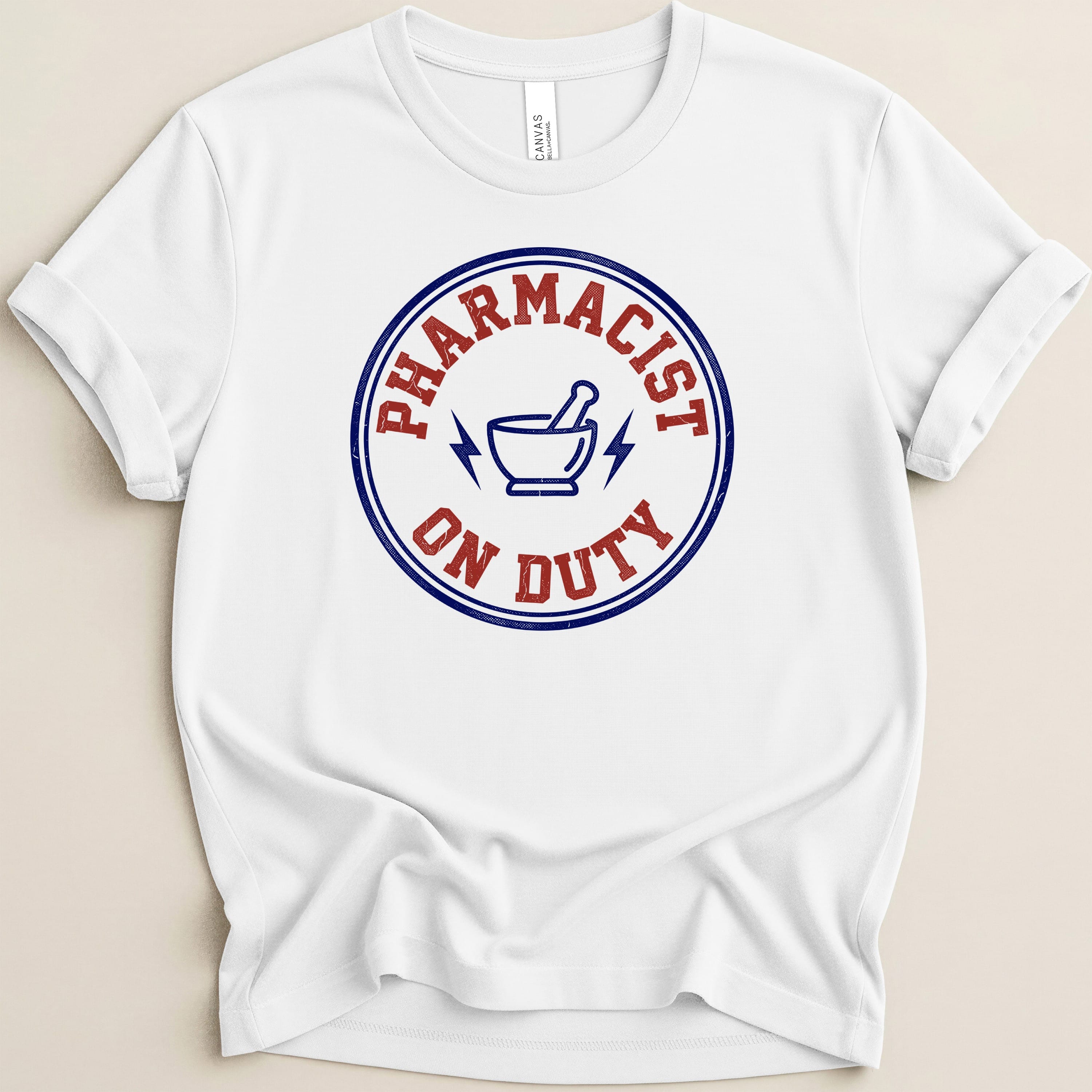 White t-shirt with "Pharmacist on Duty" circular graphic and mortar and pestle.