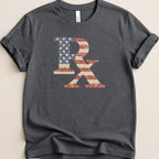Distressed American flag R and X graphic on a charcoal grey t-shirt.