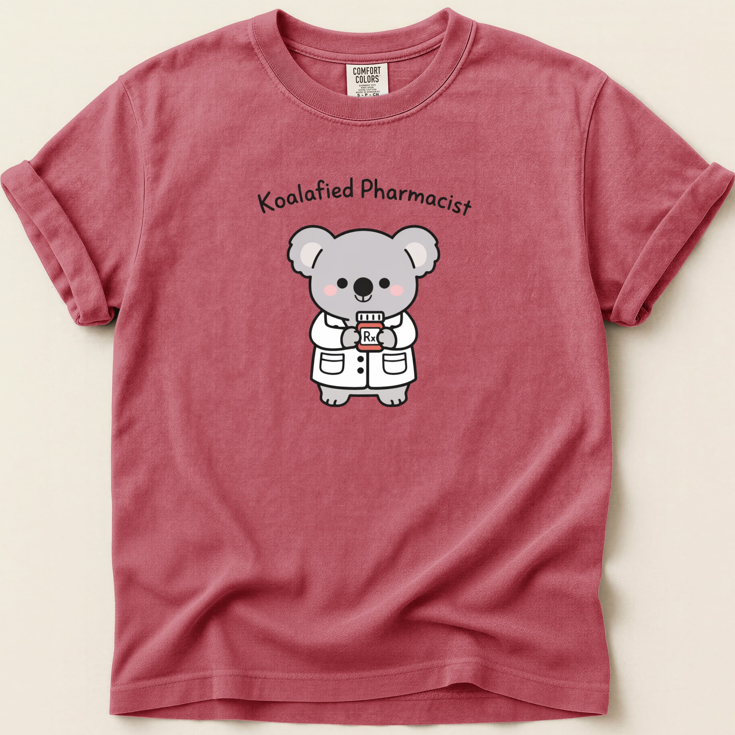 T-shirt with cartoon koala pharmacist holding a bottle labeled Rx.