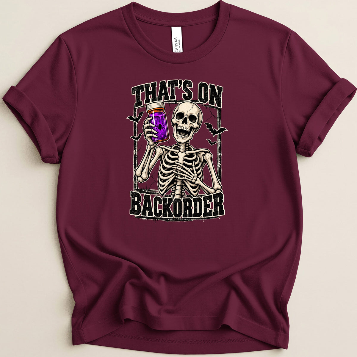 Skeleton holding jar with spider, text "That's On Backorder".