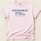 Pink t-shirt with "FREEDOMCIN 1776 mg" and "As Needed for Patriotism" text.