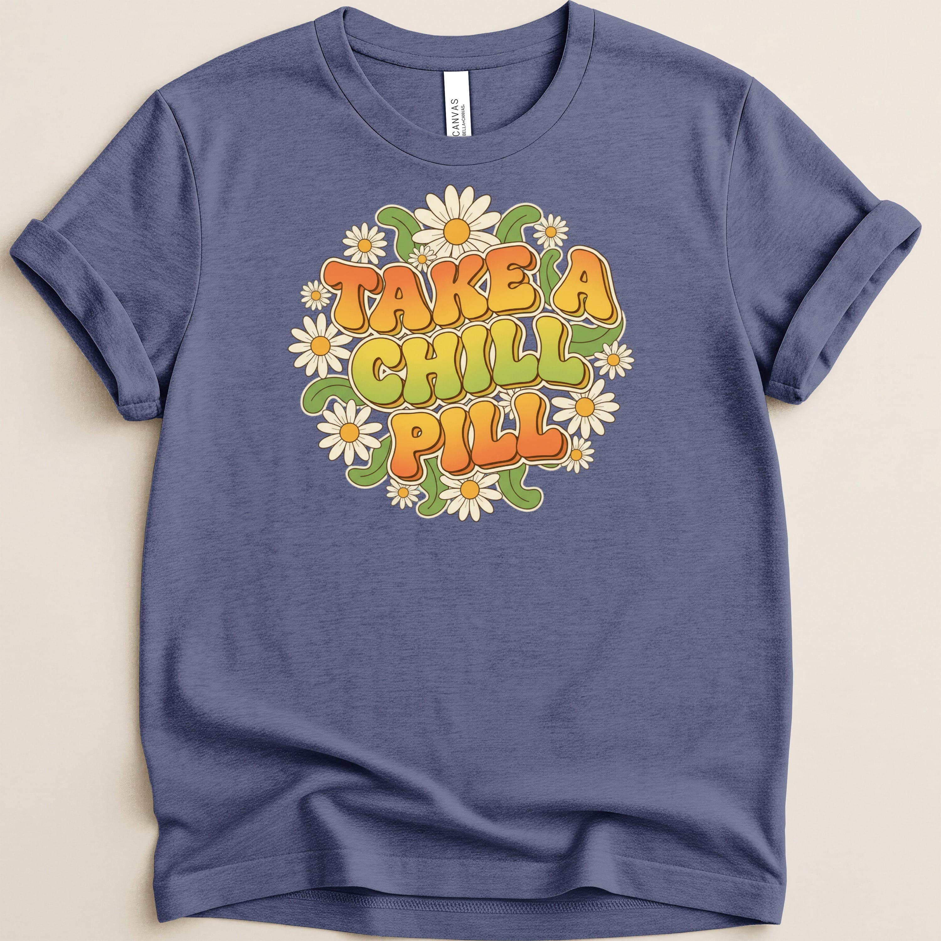 T-shirt with "Take a Chill Pill" text surrounded by daisies.