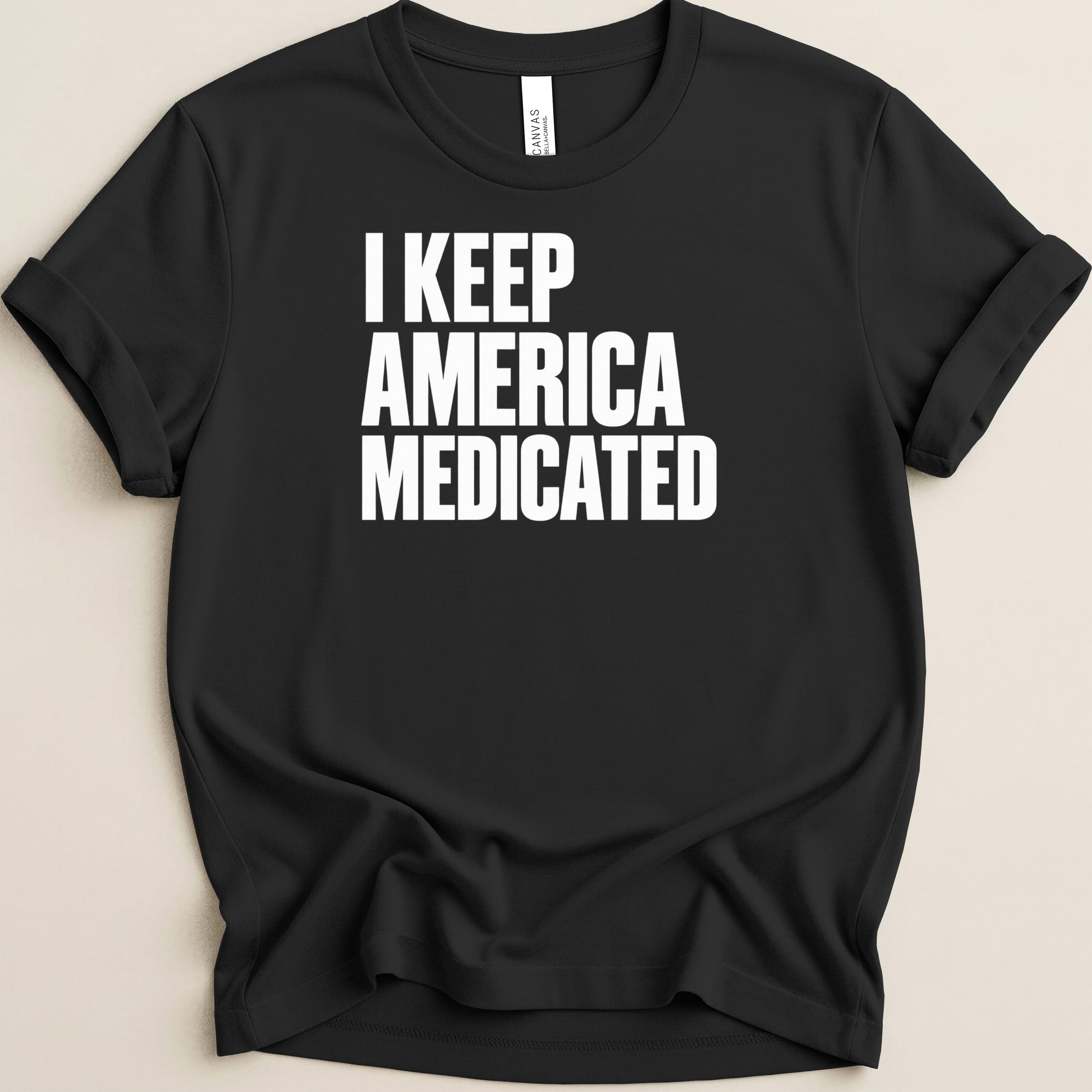 Black t-shirt with white text that reads "I KEEP AMERICA MEDICATED".