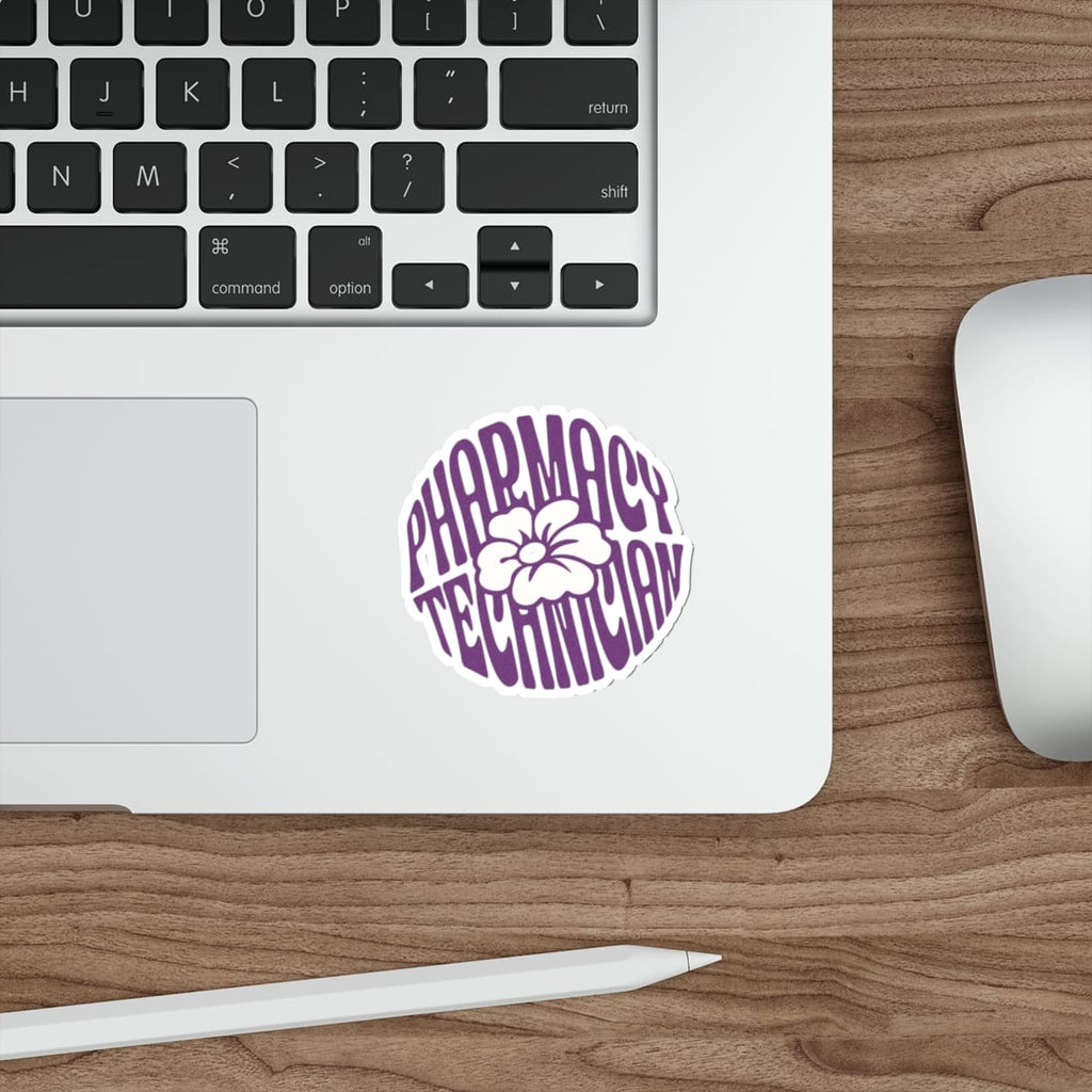 Purple and white sticker with "Pharmacy Technician" text on a laptop keyboard.