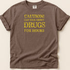 Brown t-shirt with yellow text reading "CAUTION! CAN TALK ABOUT DRUGS FOR HOURS".