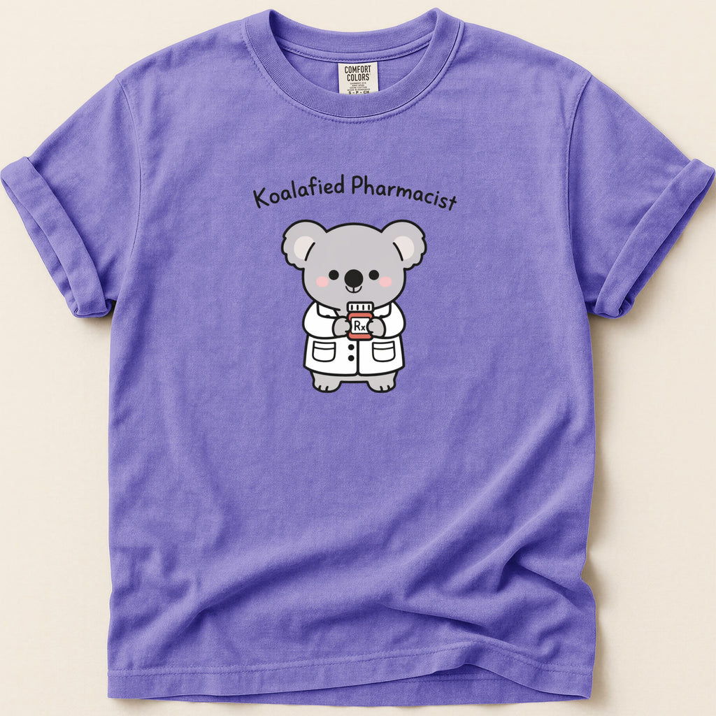 Lavender t-shirt with cartoon koala pharmacist holding a prescription bottle.