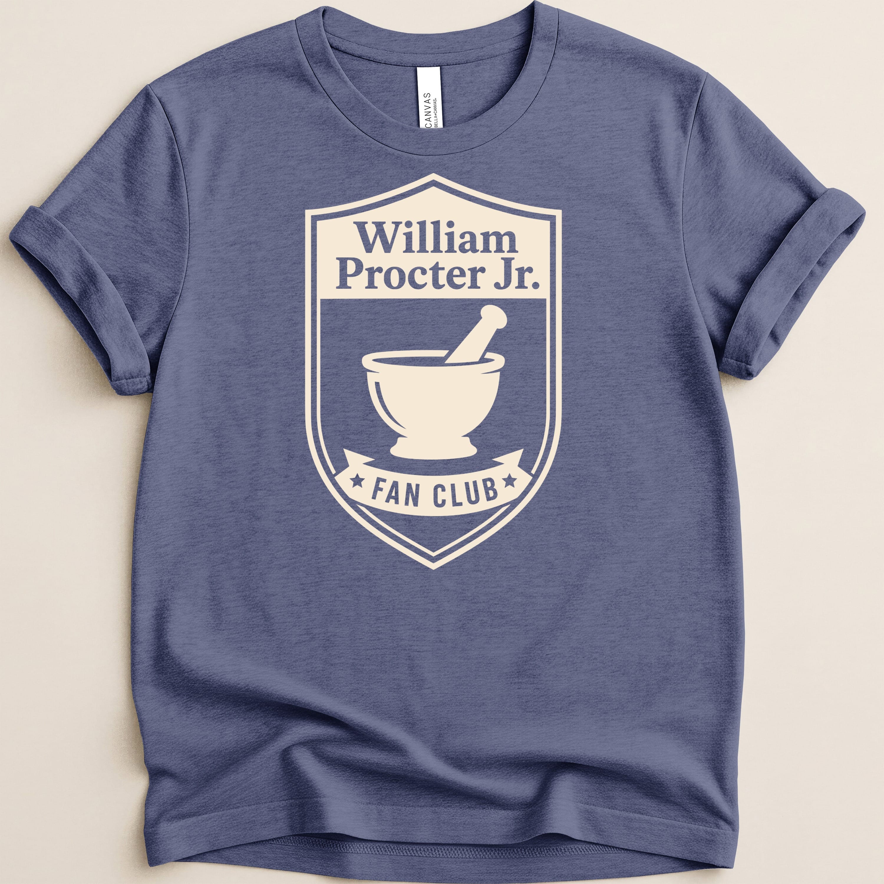 Navy t-shirt with cream William Procter Jr. Fan Club crest featuring a mortar and pestle.