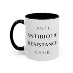 White mug with black handle and interior, reading "ANTI ANTIBIOTIC RESISTANCE CLUB".