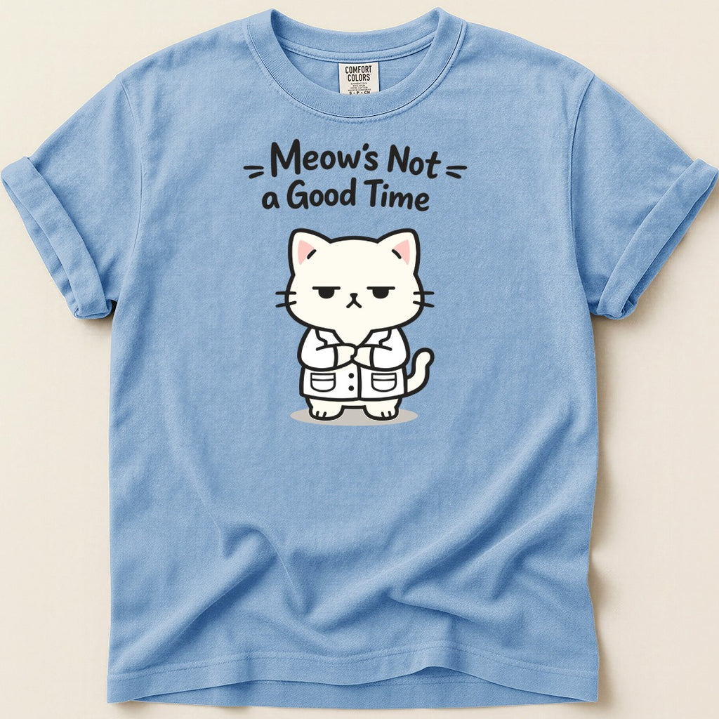 Light blue t-shirt with a grumpy white cat wearing a lab coat and text that says "Meow's Not a Good Time."