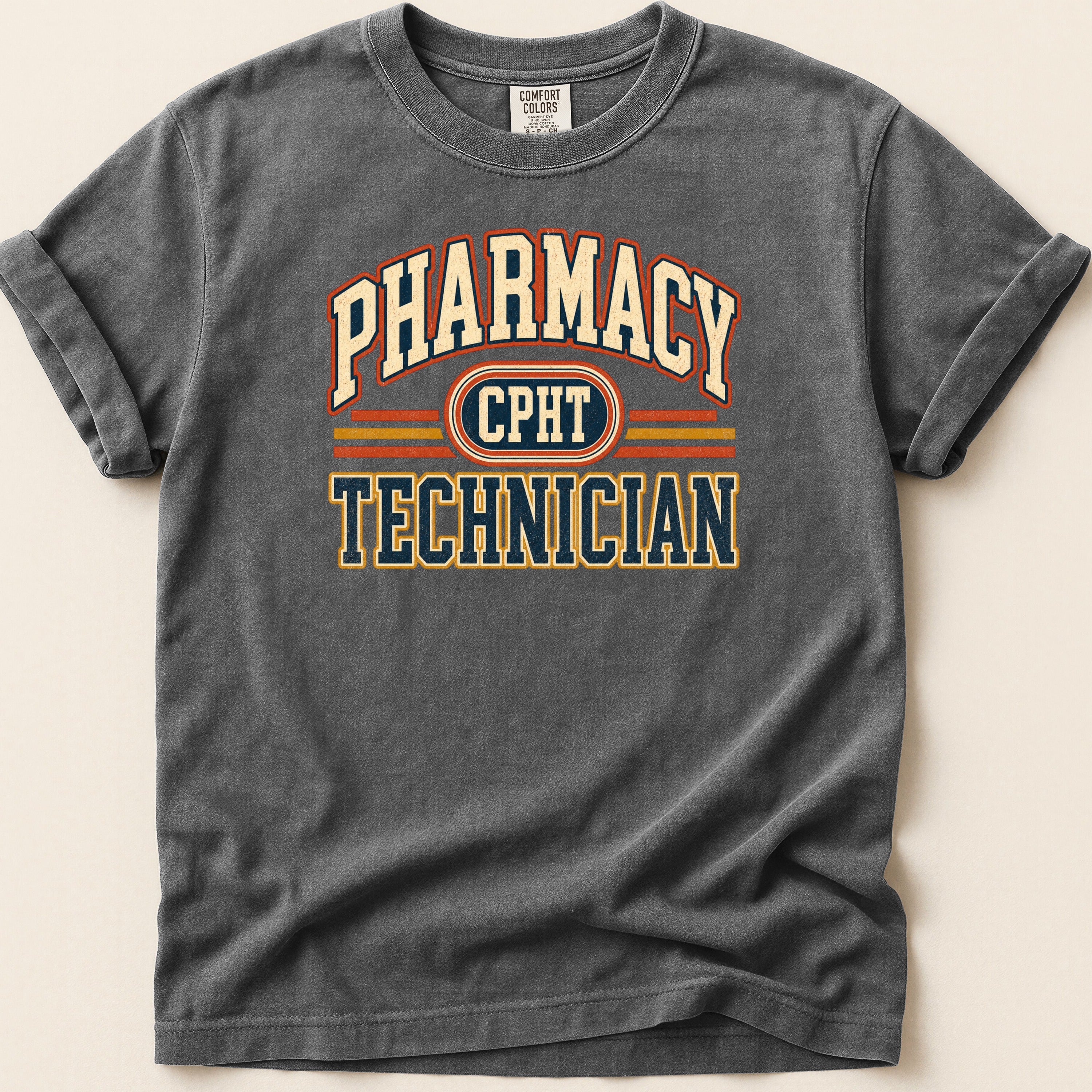 Dark grey t-shirt with "Pharmacy Technician" text in collegiate style.