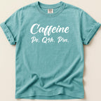 Teal t-shirt with "Caffeine Po. Q4h. Prn." text.