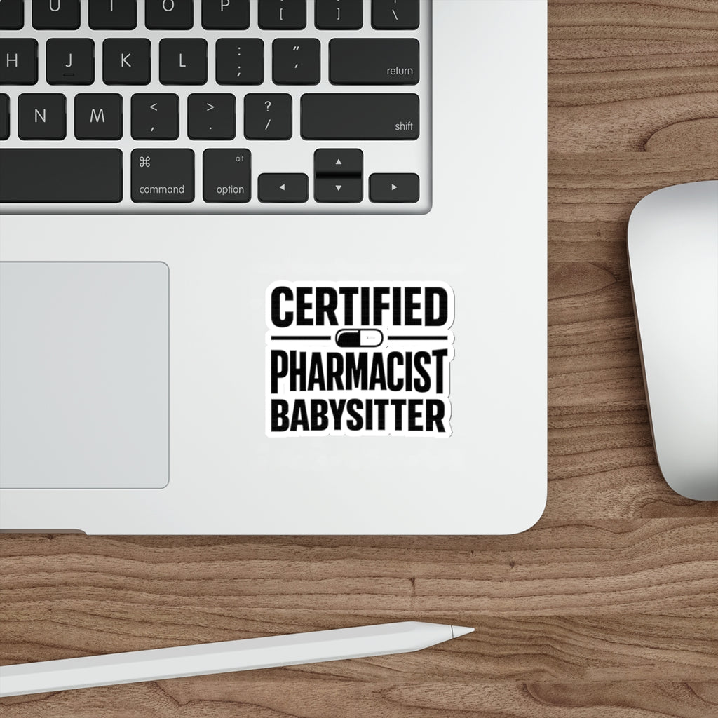 Sticker with "CERTIFIED PHARMACIST BABYSITTER" text on a laptop.