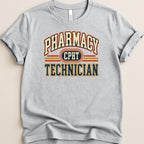 Grey t-shirt with "Pharmacy Technician" and "CPHT" text in vintage collegiate style.