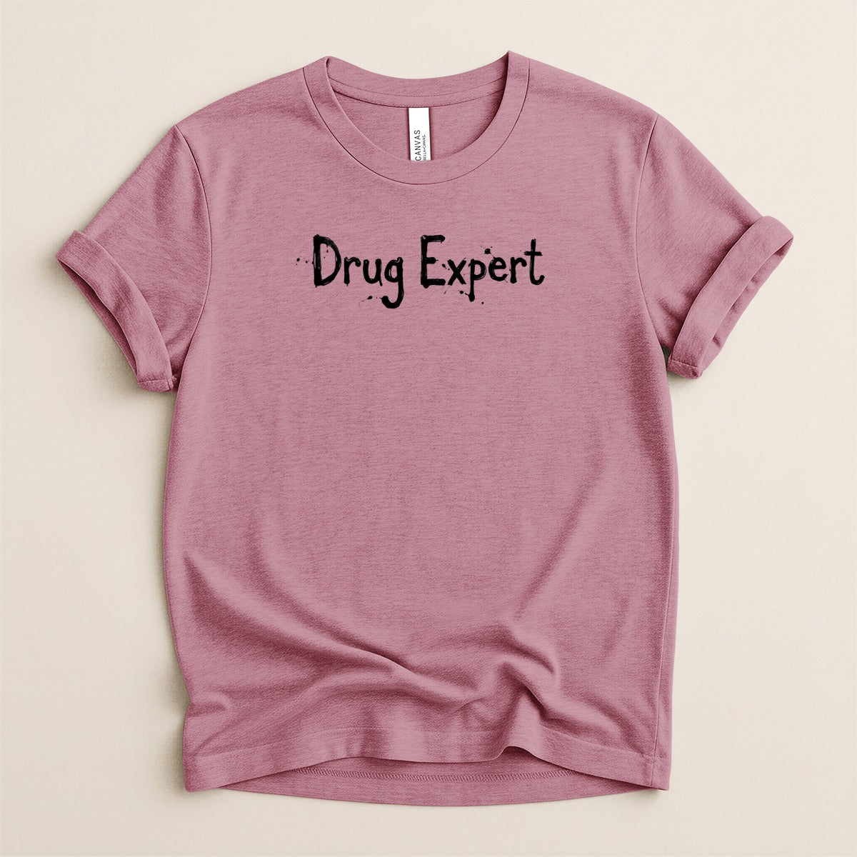 Pink t-shirt with "Drug Expert" text.