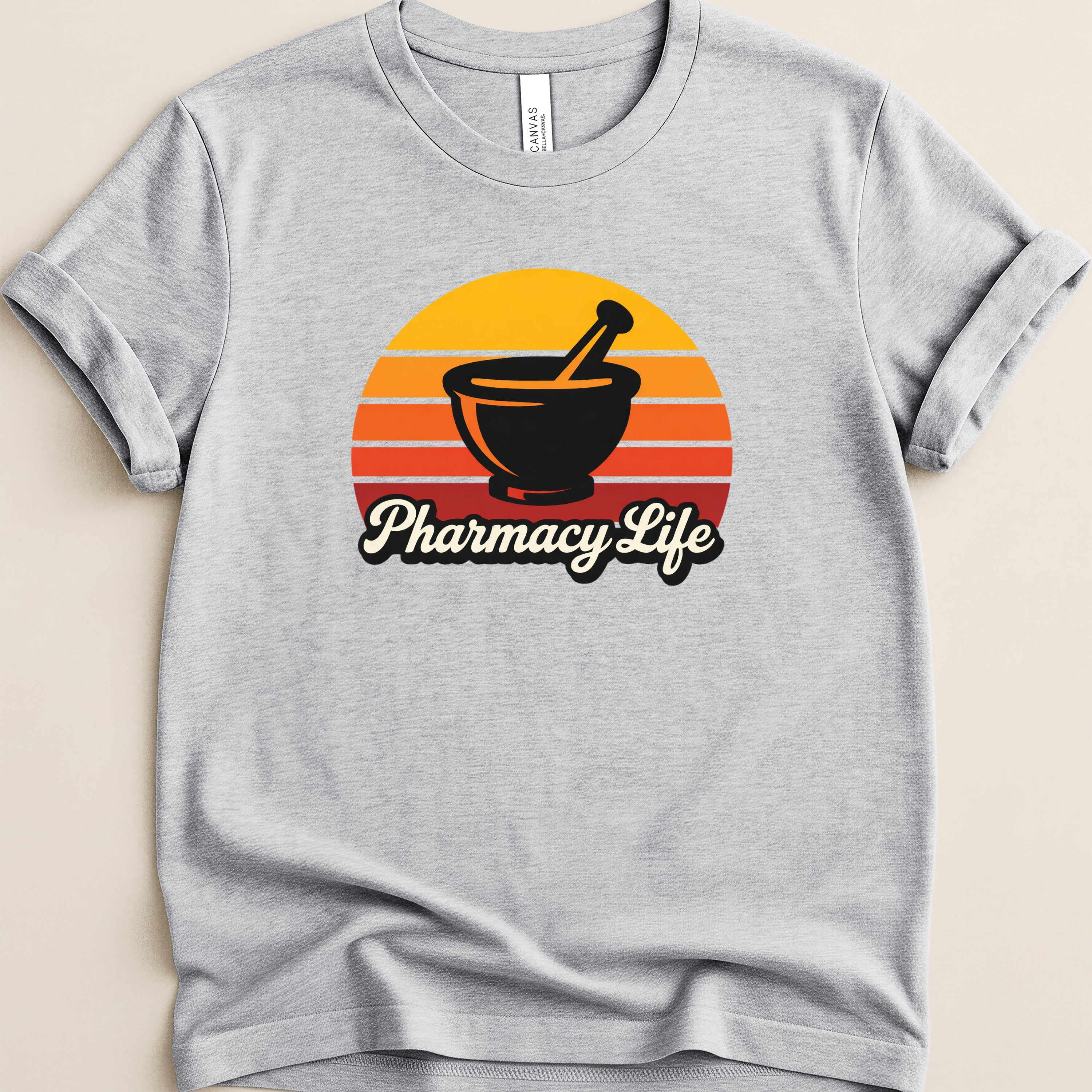 Gray t-shirt with "Pharmacy Life" text and a mortar and pestle over a sunset graphic.