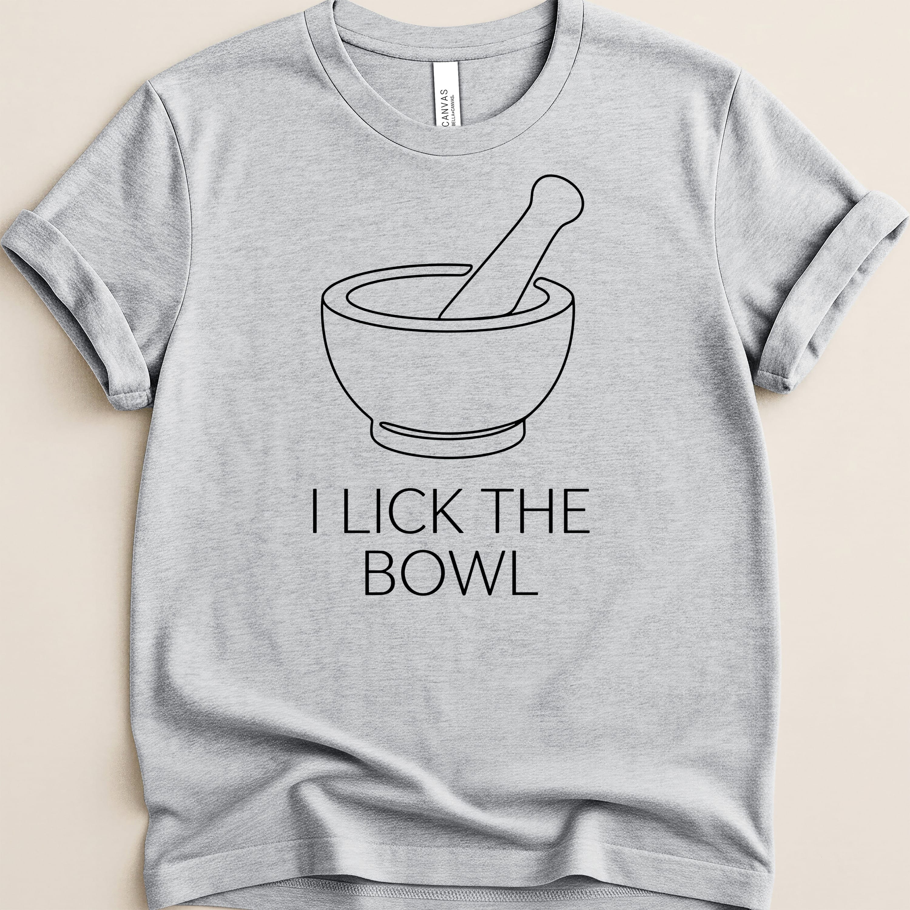 Gray t-shirt with a minimalist mortar and pestle design and text.