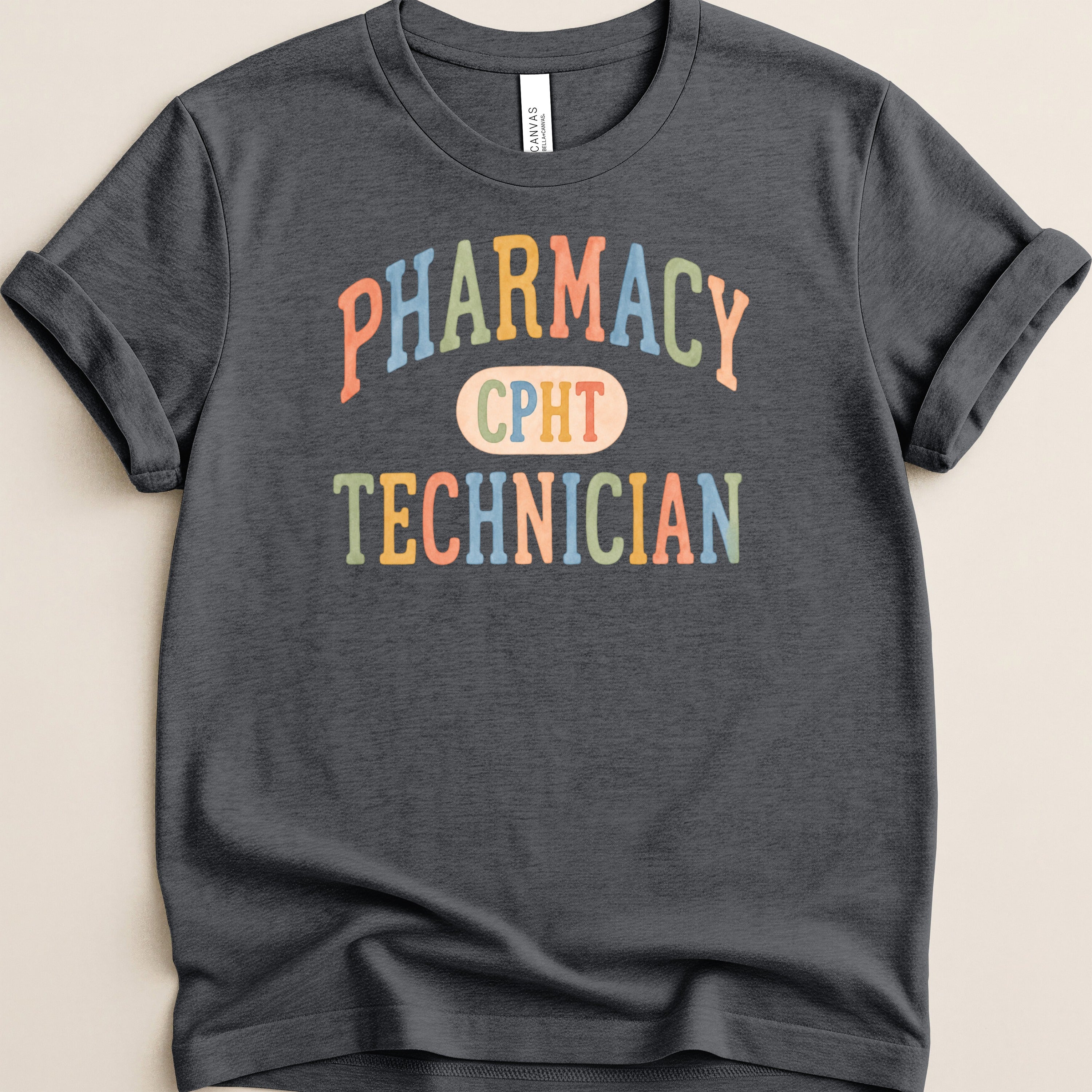 Dark t-shirt with "PHARMACY TECHNICIAN" and "CPHT" in colorful text.