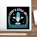 Pill character with text "THAT'S STILL ON BACKORDER" on a checkered background.