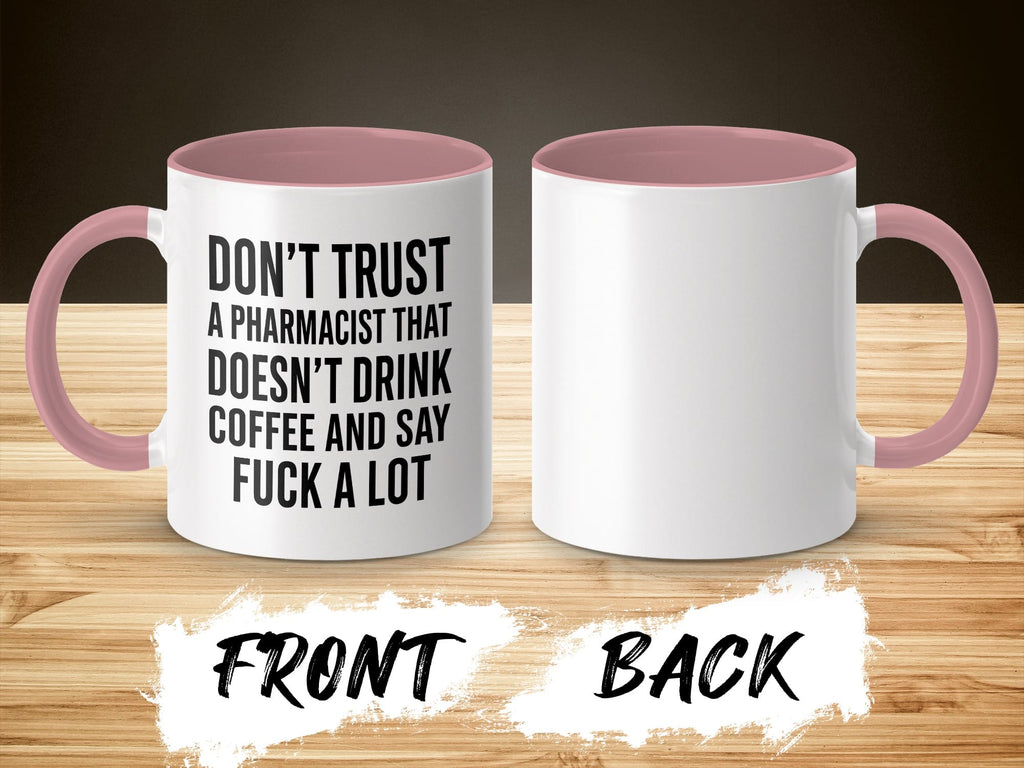 White mug with pink handle, text reads "Don't trust a pharmacist that doesn't drink coffee and say fuck a lot."