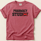 Red t-shirt with "Pharmacy Student" text, "dent" crossed out in black.